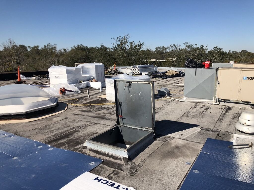 Commercial flat roof R-TECH insulation and staged materials in Winter Park, FL