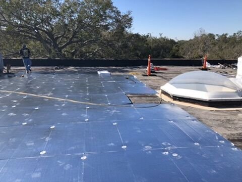 Commercial flat roof skylight curb and flashing with new insulation boards in Winter Park, FL