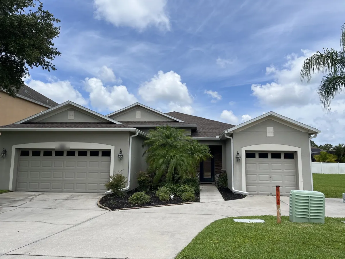 Shingle roof on a single-story home in Lake Pickett, FL by One World Roofing LLC